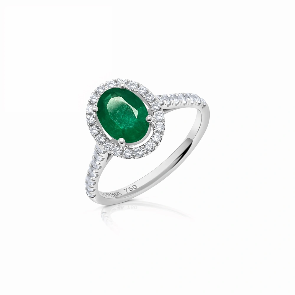 Anillo con esmeralda oval y brazo y orla de diamantes corsia
