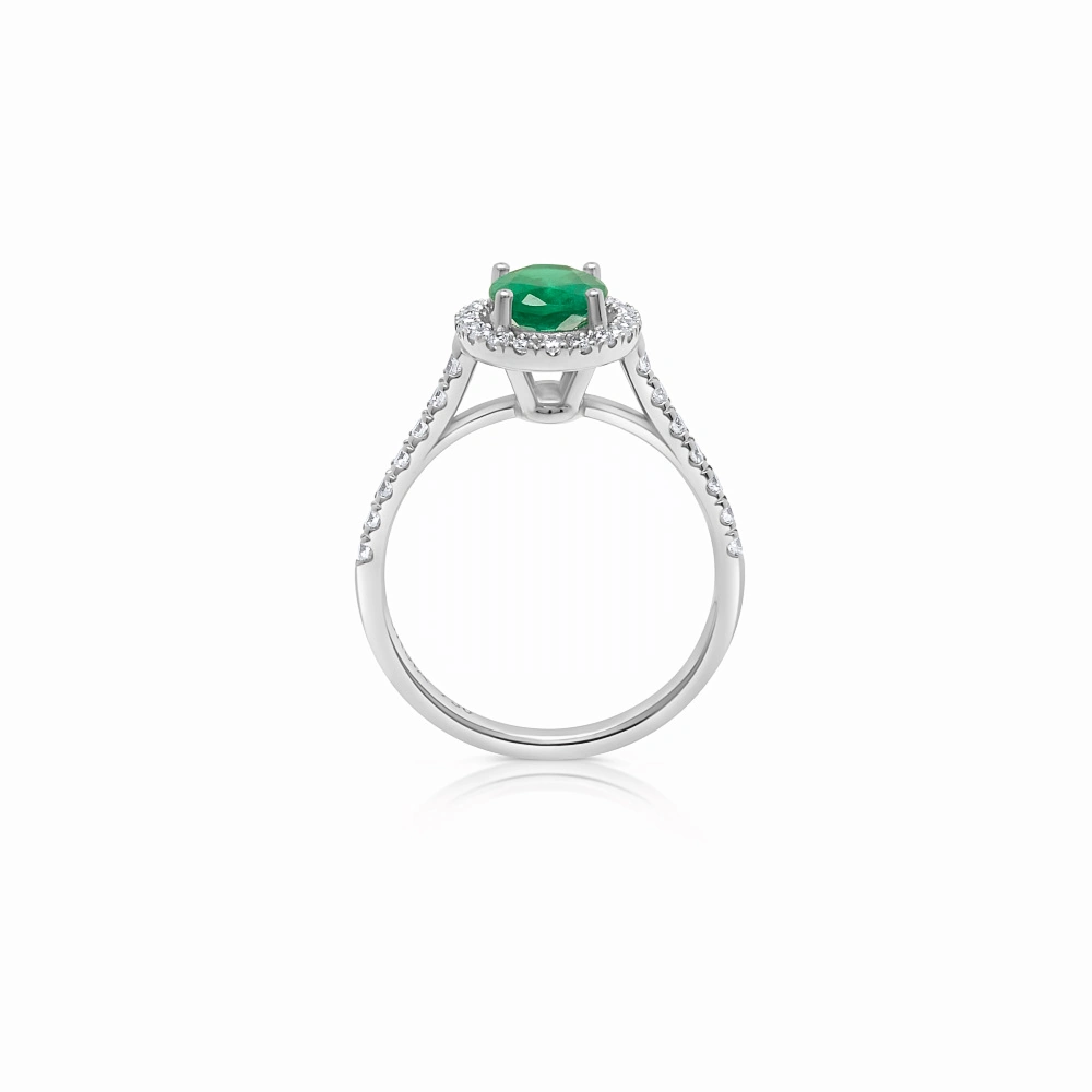 Anillo con esmeralda oval y brazo y orla de diamantes corsia