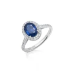 Anillo de zafiro oval con orla y brazo de diamantes oro blanco corsia